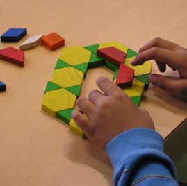 child building with pattern blocks